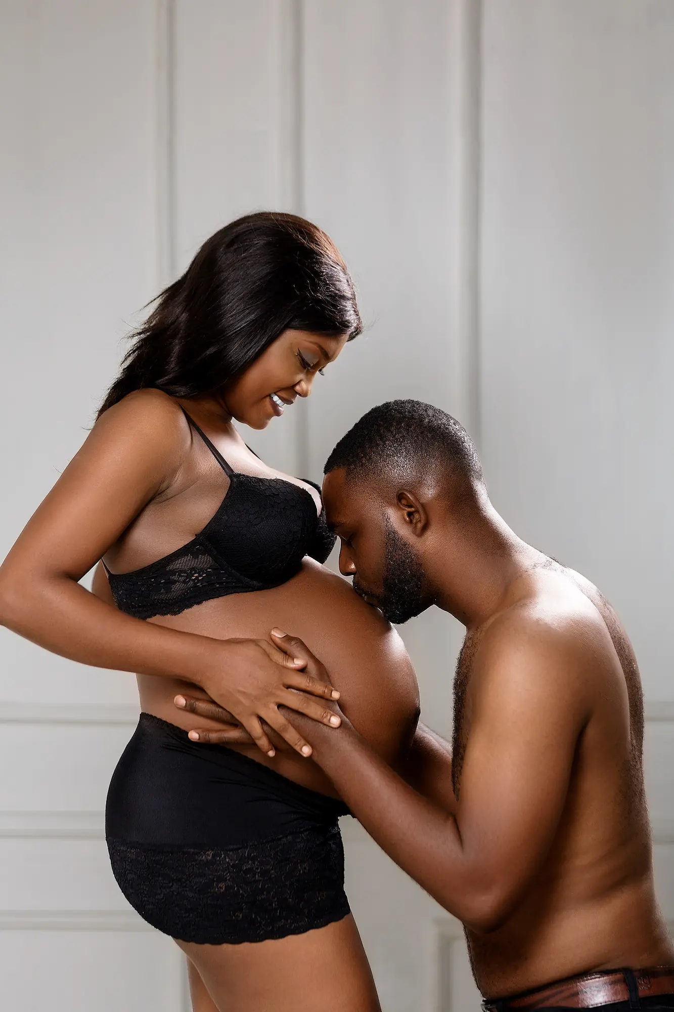 Pizaro Studios maternity session — intimate couple portrait, partner kissing the bump