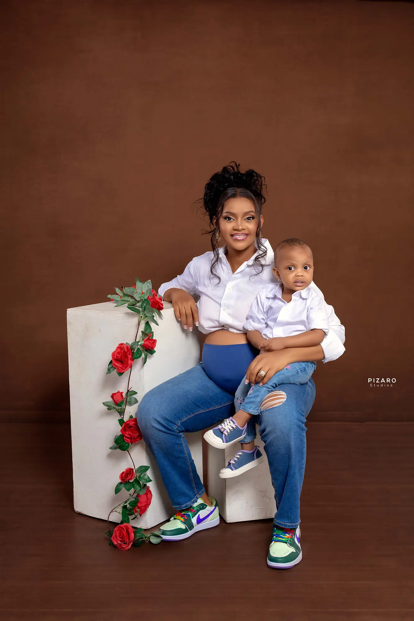 Pizaro Studios maternity session — mother and child portrait styled with roses