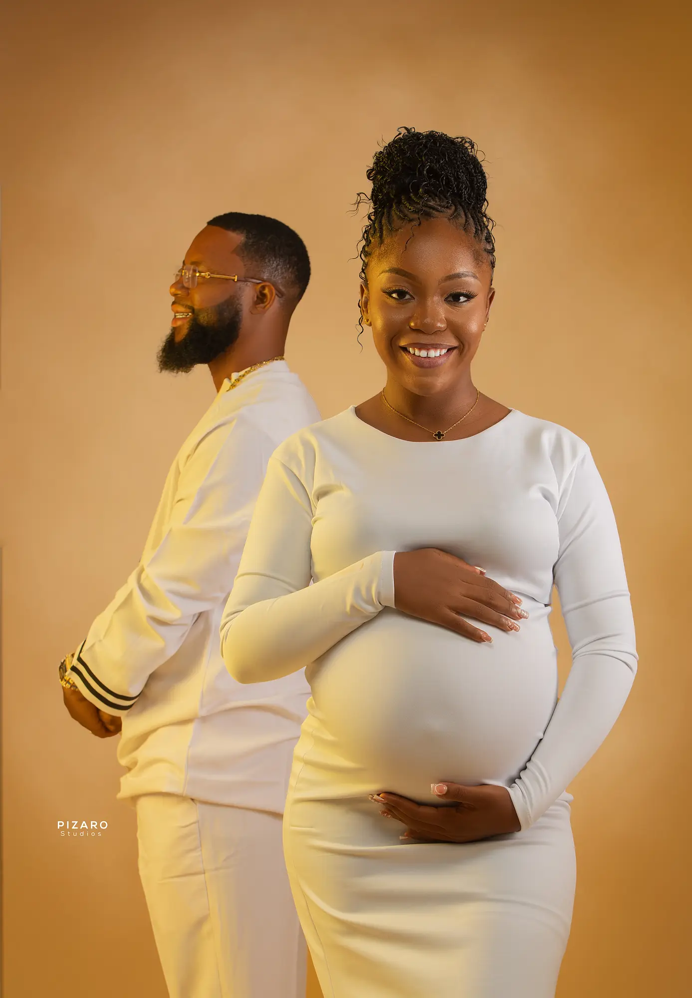 Pizaro Studios maternity session — expecting couple in coordinated white